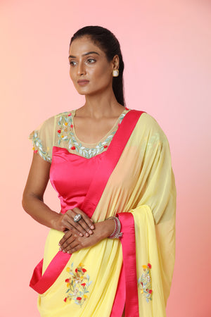 Shop beautiful yellow embroidered georgette saree online in USA with pink saree blouse. Look perfect in ethnic style on special occasions in beautiful designer sarees, embroidered sarees, party sarees, Bollywood sarees, handloom sarees from Pure Elegance Indian saree store in USA.-closeup