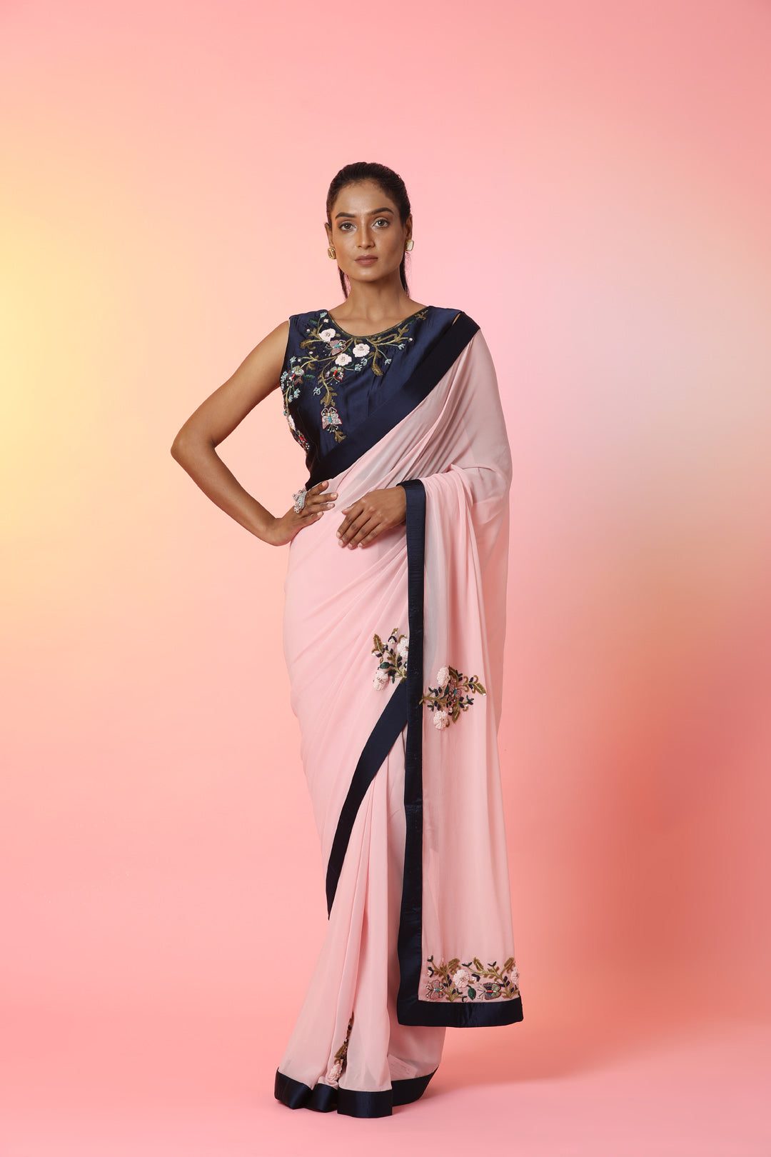 Buy beautiful powder pink embroidered georgette saree online in USA with blue border. Look perfect in ethnic style on special occasions in beautiful designer sarees, embroidered sarees, party sarees, Bollywood sarees, handloom sarees from Pure Elegance Indian saree store in USA.-full view