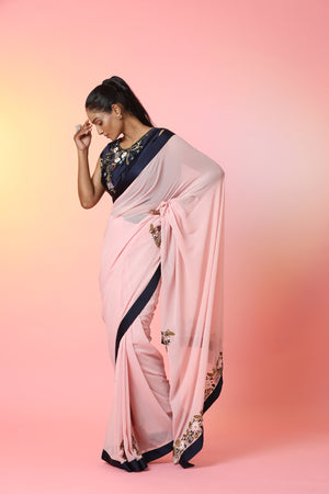 Buy beautiful powder pink embroidered georgette saree online in USA with blue border. Look perfect in ethnic style on special occasions in beautiful designer sarees, embroidered sarees, party sarees, Bollywood sarees, handloom sarees from Pure Elegance Indian saree store in USA.-pallu