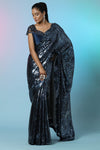 Buy stunning blue sequin designer sequin saree online in USA with embellished blouse. Look perfect in ethnic style on special occasions in beautiful designer sarees, embroidered sarees, party sarees, Bollywood sarees, handloom sarees from Pure Elegance Indian saree store in USA.-full view