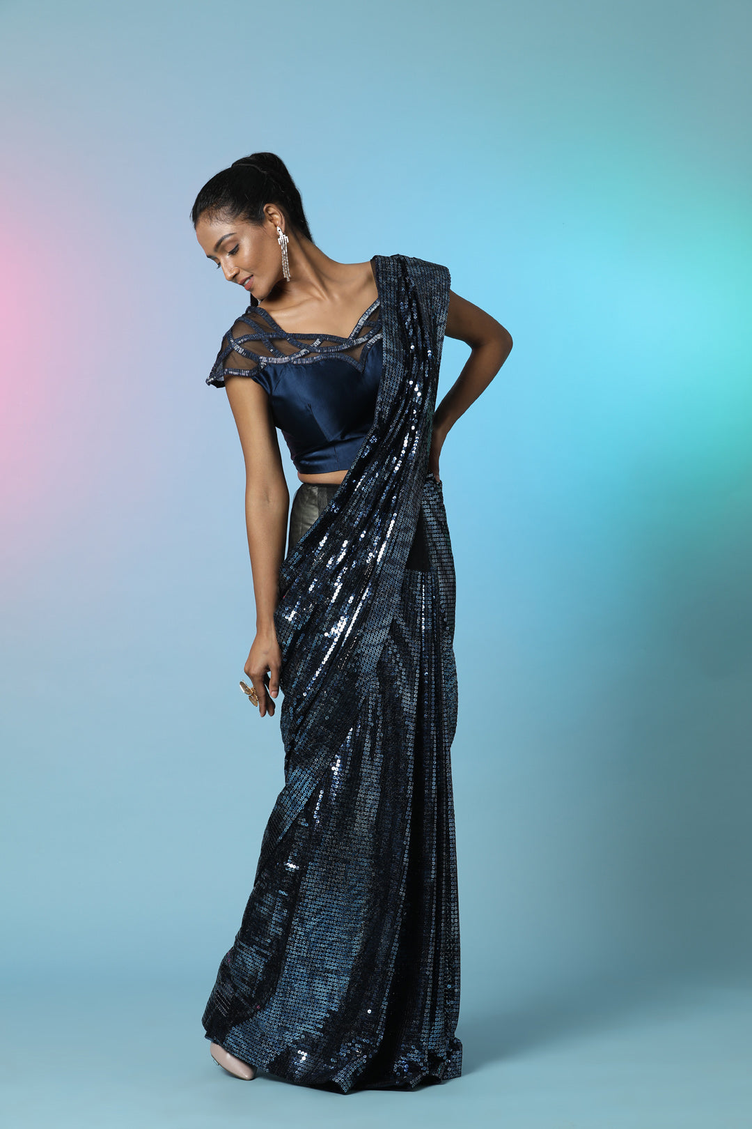 Buy stunning blue sequin designer sequin saree online in USA with embellished blouse. Look perfect in ethnic style on special occasions in beautiful designer sarees, embroidered sarees, party sarees, Bollywood sarees, handloom sarees from Pure Elegance Indian saree store in USA.-side
