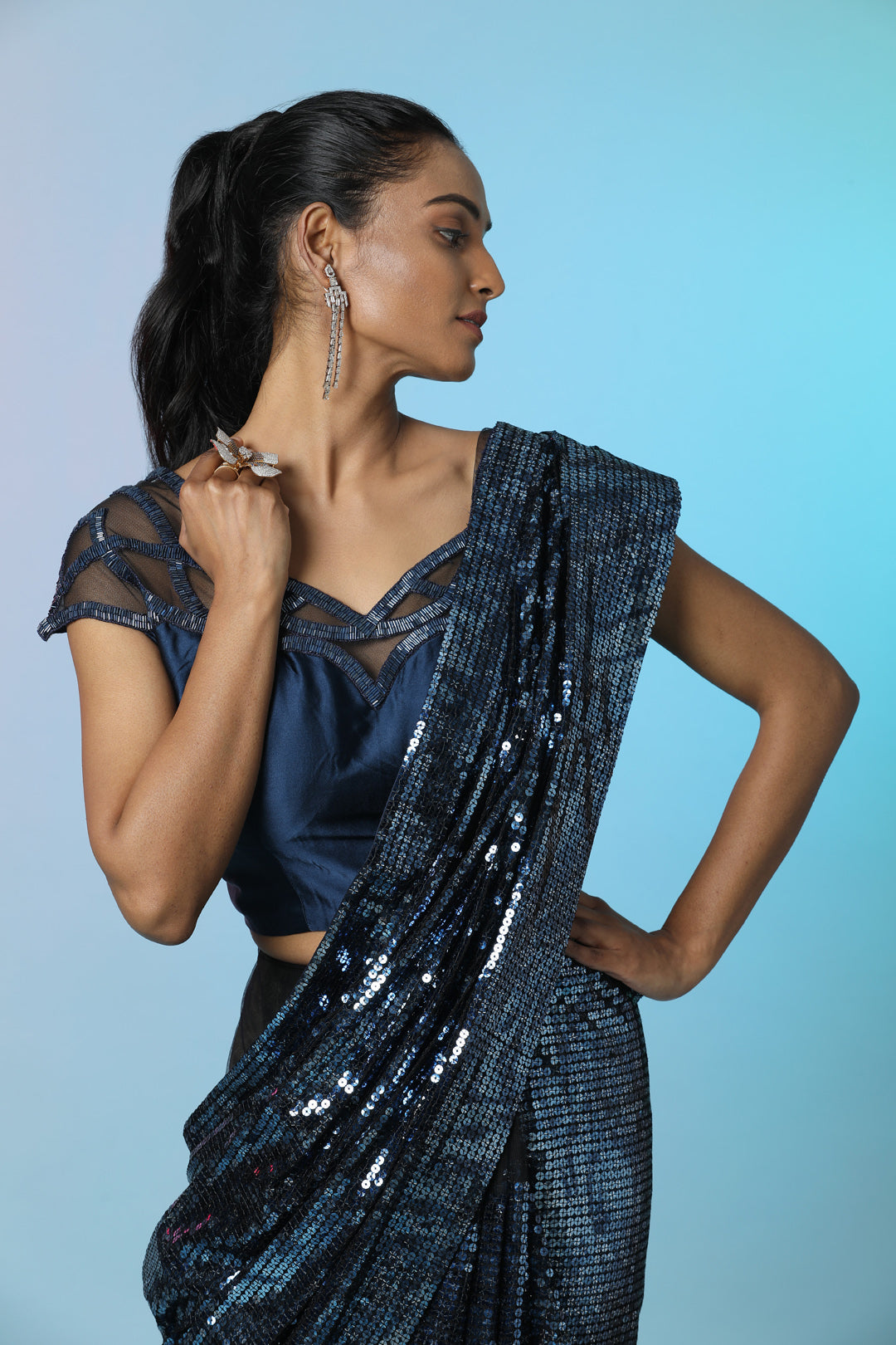 Buy stunning blue sequin designer sequin saree online in USA with embellished blouse. Look perfect in ethnic style on special occasions in beautiful designer sarees, embroidered sarees, party sarees, Bollywood sarees, handloom sarees from Pure Elegance Indian saree store in USA.-closeup