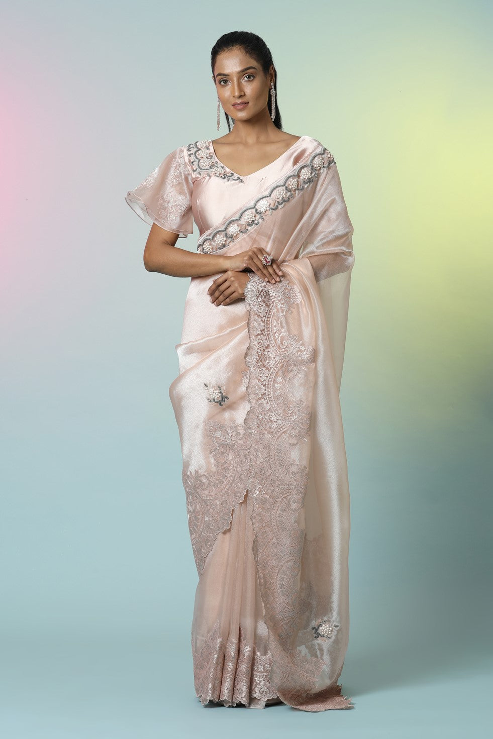 Shop beautiful champagne pink embroidered tissue organza saree online in USA with saree blouse. Look perfect in ethnic style on special occasions in beautiful designer sarees, embroidered sarees, party sarees, Bollywood sarees, handloom sarees from Pure Elegance Indian saree store in USA.-full view