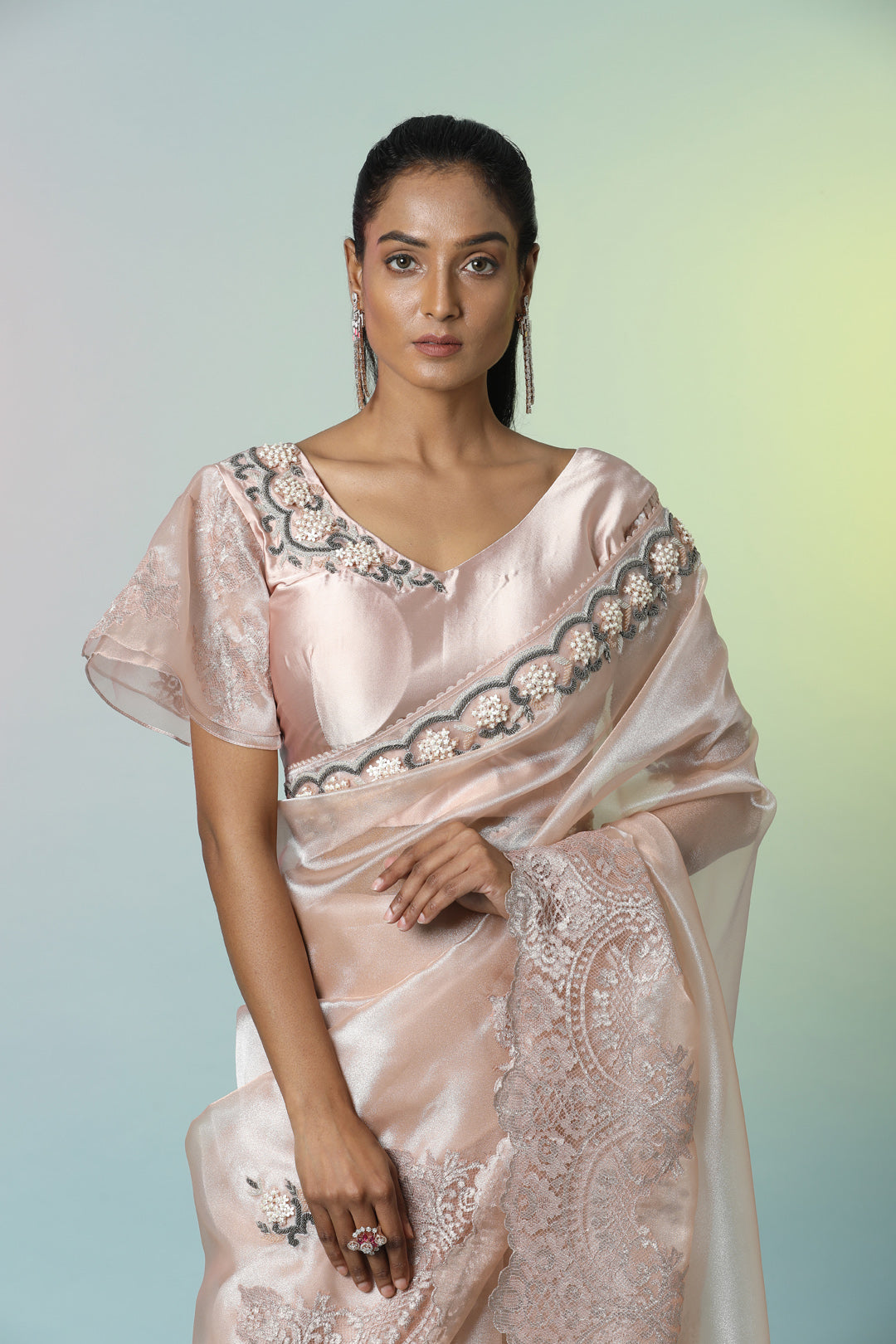 Shop beautiful champagne pink embroidered tissue organza saree online in USA with saree blouse. Look perfect in ethnic style on special occasions in beautiful designer sarees, embroidered sarees, party sarees, Bollywood sarees, handloom sarees from Pure Elegance Indian saree store in USA.-closeup