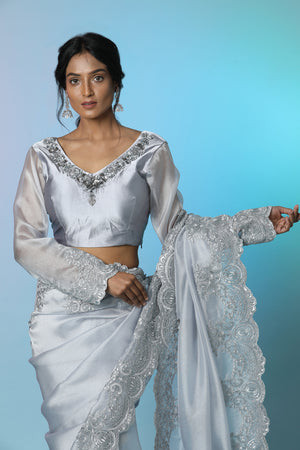 Buy beautiful light grey tissue georgette saree online in USA with saree blouse. Look perfect in ethnic style on special occasions in beautiful designer sarees, embroidered sarees, party sarees, Bollywood sarees, handloom sarees from Pure Elegance Indian saree store in USA.-closeup