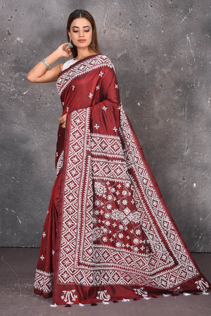 Shop this elegant maroon pure bangalore silk saree with white gujarati stitch work online in USA ,traditionally crafted by their enriched talent to give the buyer an experience in itself. Check this designer bangalore silk saree with white gujarati Stitch Art work and purely hand thread needle work. Add this glamourous designer saree to your collection from Pure Elegance Indian fashion store in USA.- Side view with open pallu.