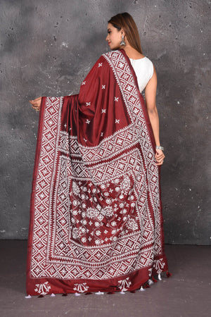 Shop this elegant maroon pure bangalore silk saree with white gujarati stitch work online in USA ,traditionally crafted by their enriched talent to give the buyer an experience in itself. Check this designer bangalore silk saree with white gujarati Stitch Art work and purely hand thread needle work. Add this glamourous designer saree to your collection from Pure Elegance Indian fashion store in USA.- Back view with open pallu.