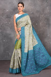 Buy this exquisite hand block printed designer saree in silver-grey and blue color with kutch work online in USA.  Add this hand-embroidered tussar sari which has made up of pure tussar silk. These sarees can be worn for any occasion - It carries a class. Buy this tussar sari with any blouse from Pure Elegance Indian saree store in USA.- Full view.