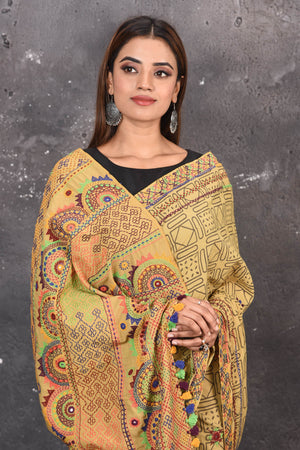 Shop this classy mustard yellow hand painted madhubani cotton saree online in USA. Perfect to be worn as part of your everyday work wear, with this hand-painted Mustard Yellow Madhubani saree, elegance meets traditional. Add this designer Lambani embroidery designer saree to your collection from Pure Elegance Indian Fashion Store in USA.- Close up.