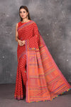 Shop this classy red hand painted madhubani cotton saree online in USA. Perfect to be worn as part of your everyday work wear, with this hand-painted red Madhubani saree, elegance meets traditional. Add this designer Lambani embroidery designer saree with colored tassels to your collection from Pure Elegance Indian Fashion Store in USA.- Full view.