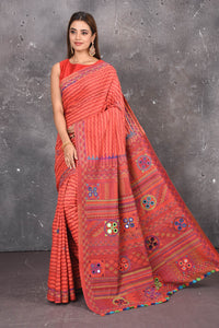 Buy this classy red hand painted madhubani cotton leheriya pattern saree online in USA. Perfect to be worn as part of your everyday work wear, with this hand-painted red Madhubani saree, elegance meets traditional. Add this designer Lambani embroidery designer saree with colored tassels to your collection from Pure Elegance Indian Fashion Store in USA.- Full view with open pallu.