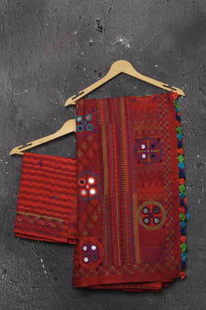 Buy this classy red hand painted madhubani cotton leheriya pattern saree online in USA. Perfect to be worn as part of your everyday work wear, with this hand-painted red Madhubani saree, elegance meets traditional. Add this designer Lambani embroidery designer saree with colored tassels to your collection from Pure Elegance Indian Fashion Store in USA.- Unstitched blouse.