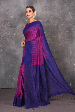 Shop this elegant blue-pink handloom shibori tussar saree online in USA which is handcrafted from fine silk tussar fabric, this tie and dye saree brings out the nature of flow. You can pair this beautiful shibori print with minimal jewellery for a casual day outfit. Add this plain shibori saree to your collection from Pure Elegance Indian fashion store in USA.- Side view.