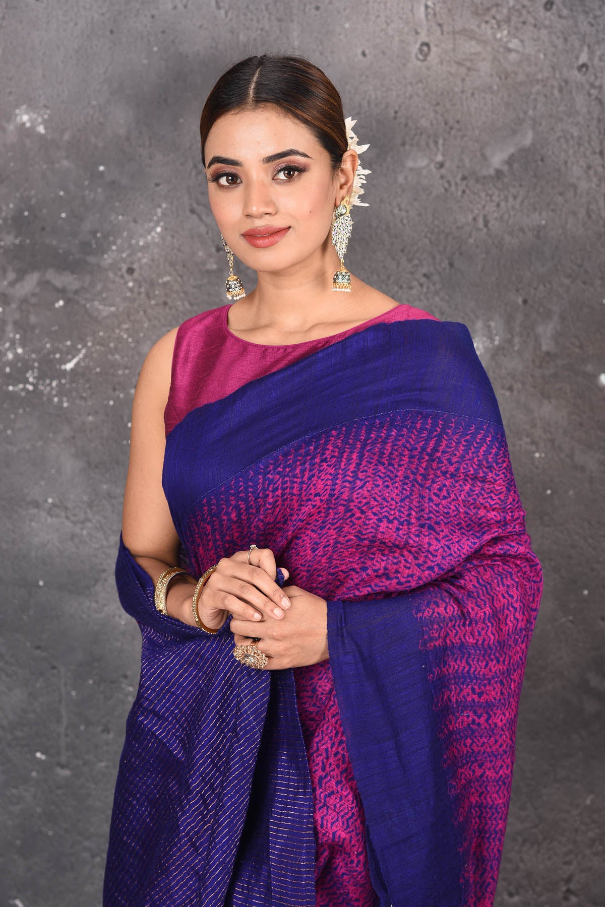 Shop this elegant blue-pink handloom shibori tussar saree online in USA which is handcrafted from fine silk tussar fabric, this tie and dye saree brings out the nature of flow. You can pair this beautiful shibori print with minimal jewellery for a casual day outfit. Add this plain shibori saree to your collection from Pure Elegance Indian fashion store in USA.-Close up.