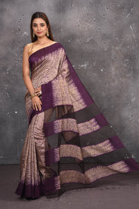 Shop this elegant purple-gold handloom shibori tussar saree online in USA which is handcrafted from fine silk tussar fabric, this tie and dye saree brings out the nature of flow. You can pair this beautiful shibori print with minimal jewellery for a casual day outfit. Add this plain shibori saree to your collection from Pure Elegance Indian fashion store in USA.-Full view.