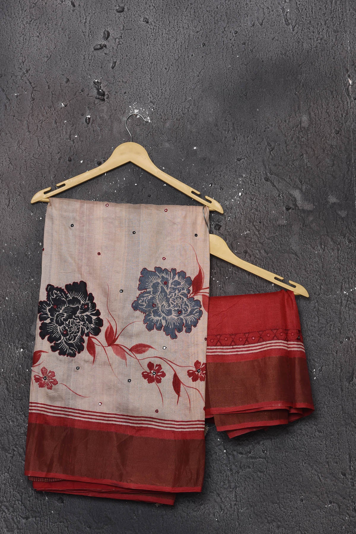 Buy this elegant offwhite-red pure tussar saree with floral embroidered hand cutwork border online in USA which is handcrafted from fine silk tussar fabric, this tie and dye saree brings out the nature of flow. You can pair this beautiful floral embroidered print saree with minimal jewellery for a casual day outfit. Add this pure tussar saree to your collection from Pure Elegance Indian fashion store in USA.-Unstitched blouse.