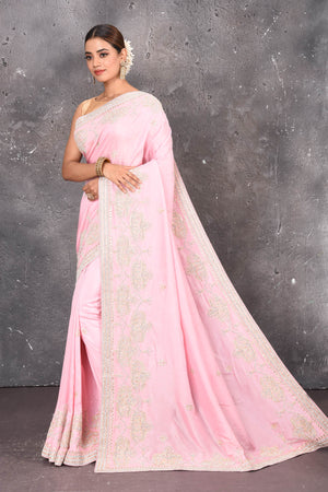 Shop this elegant baby pink gota patti mirror embroidered soft organza silk designer saree online in USA with colourful threadwork of flowers, gota patti leaves and dazzling cut dana and mirror work details. Mirror bootis are scattered all over the saree to match the brightness of the happy pink look. Add this designer sari to your collection from Pure Elegance Indian fashion store in USA.-Full view with folded hands.