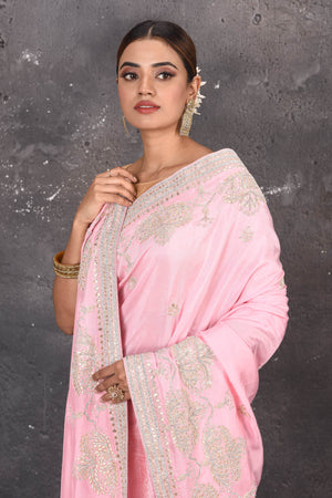 Shop this elegant baby pink gota patti mirror embroidered soft organza silk designer saree online in USA with colourful threadwork of flowers, gota patti leaves and dazzling cut dana and mirror work details. Mirror bootis are scattered all over the saree to match the brightness of the happy pink look. Add this designer sari to your collection from Pure Elegance Indian fashion store in USA.-Close up.
