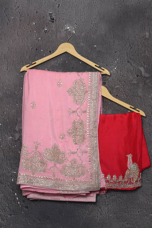 Shop this elegant baby pink gota patti mirror embroidered soft organza silk designer saree online in USA with colourful threadwork of flowers, gota patti leaves and dazzling cut dana and mirror work details. Mirror bootis are scattered all over the saree to match the brightness of the happy pink look. Add this designer sari to your collection from Pure Elegance Indian fashion store in USA.-Unstitched blouse.