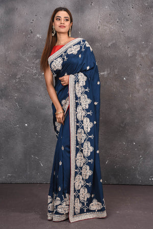Buy this elegant navy blue gota patti mirror embroidered soft organza silk designer saree online in USA with colourful threadwork of flowers, gota patti leaves and dazzling cut dana and mirror work details. Mirror bootis are scattered all over the saree to match the brightness of the happy look. Add this designer sari to your collection from Pure Elegance Indian fashion store in USA.-Full view.