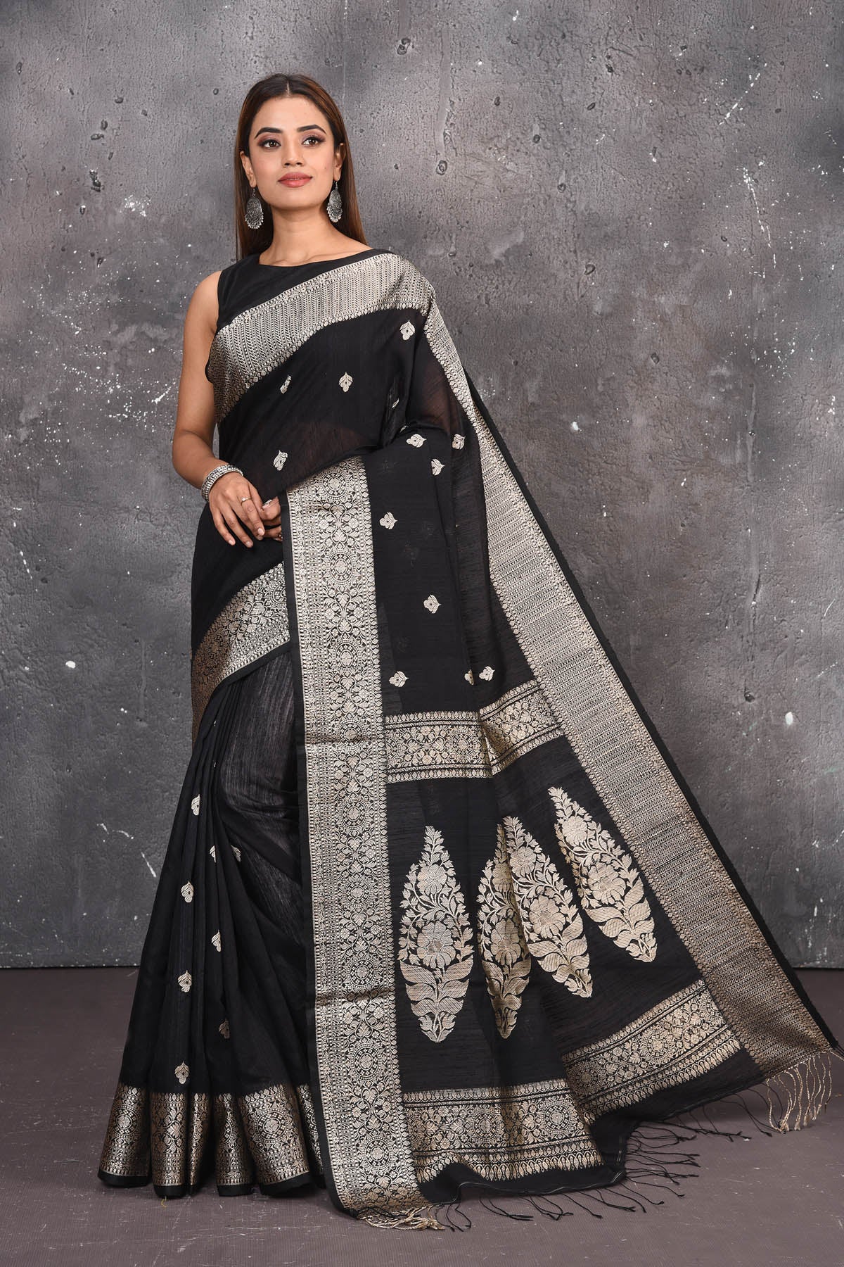Buy elegant black zari woven matka Silk Banarasi saree with zari broad border online in USA which has crafted by skilled weaver of Banaras with elegance and grace, this saree is definitely the epitome of beauty and a must have in your collection. Buy designer handwoven banarasi brocade sari with any blouse from Pure Elegance Indian saree store in USA. -Full view.