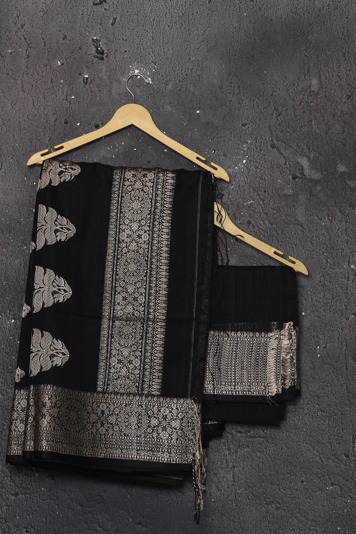 Buy elegant black zari woven matka Silk Banarasi saree with zari broad border online in USA which has crafted by skilled weaver of Banaras with elegance and grace, this saree is definitely the epitome of beauty and a must have in your collection. Buy designer handwoven banarasi brocade sari with any blouse from Pure Elegance Indian saree store in USA. -Unstitched blouse.