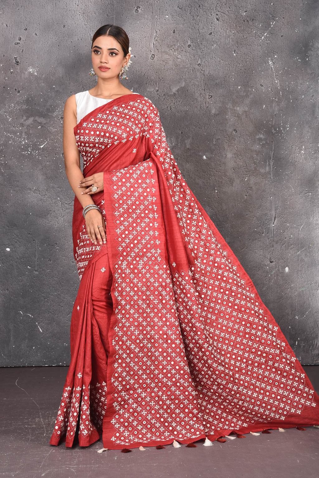 Shop elegant red zari woven pure tussar gicha silk saree in red color with beautiful mirrorwork online in USA which has crafted by skilled weaver of Banaras with elegance and grace, this saree is definitely the epitome of beauty and a must have in your collection. Buy designer handwoven sarees from Pure Elegance which brings you our latest collection of Bhagalpuri handwoven tussar silk sarees.-Full view.