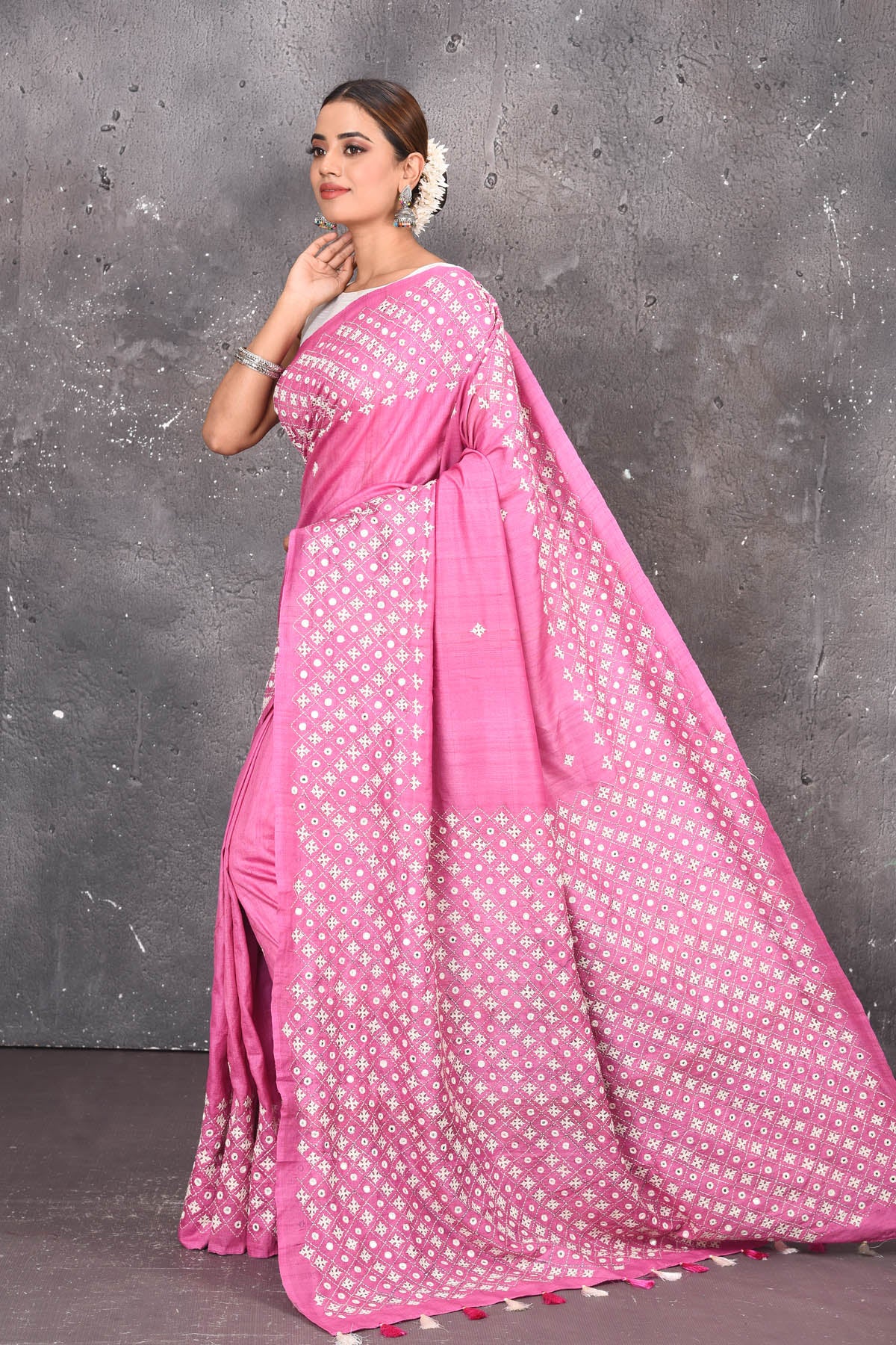 Shop elegant red zari woven pure tussar gicha silk saree in pink color with beautiful mirrorwork online in USA which has crafted by skilled weaver of Banaras with elegance and grace, this saree is definitely the epitome of beauty and a must have in your collection. Buy designer handwoven sarees from Pure Elegance which brings you our latest collection of Bhagalpuri handwoven tussar silk sarees.-Side view with open pallu.
