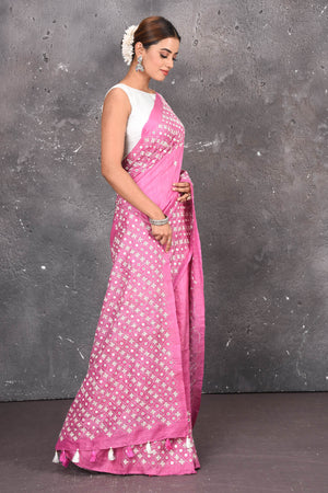 Shop elegant red zari woven pure tussar gicha silk saree in pink color with beautiful mirrorwork online in USA which has crafted by skilled weaver of Banaras with elegance and grace, this saree is definitely the epitome of beauty and a must have in your collection. Buy designer handwoven sarees from Pure Elegance which brings you our latest collection of Bhagalpuri handwoven tussar silk sarees.-Side view.