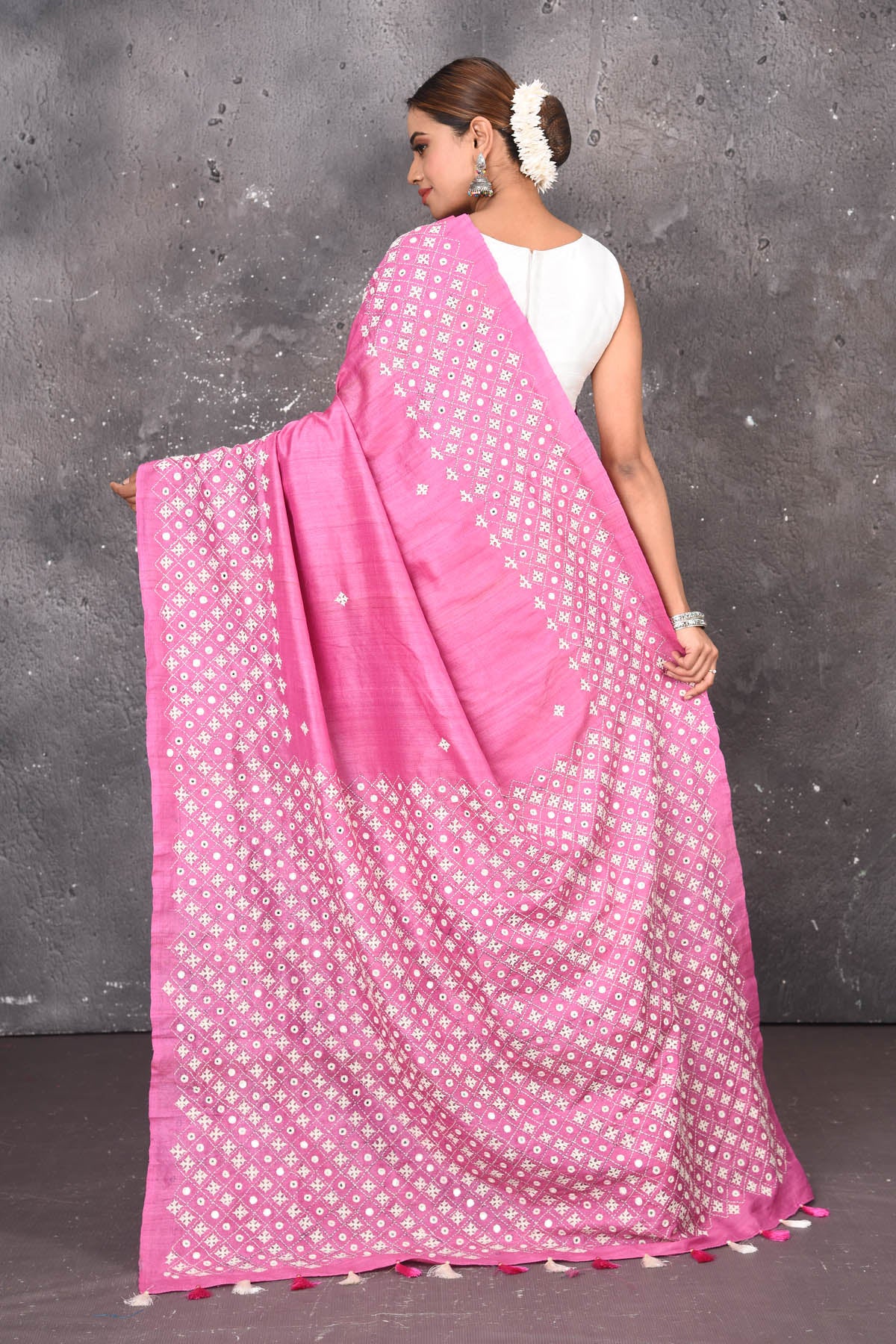 Shop elegant red zari woven pure tussar gicha silk saree in pink color with beautiful mirrorwork online in USA which has crafted by skilled weaver of Banaras with elegance and grace, this saree is definitely the epitome of beauty and a must have in your collection. Buy designer handwoven sarees from Pure Elegance which brings you our latest collection of Bhagalpuri handwoven tussar silk sarees.-Back view with open pallu.