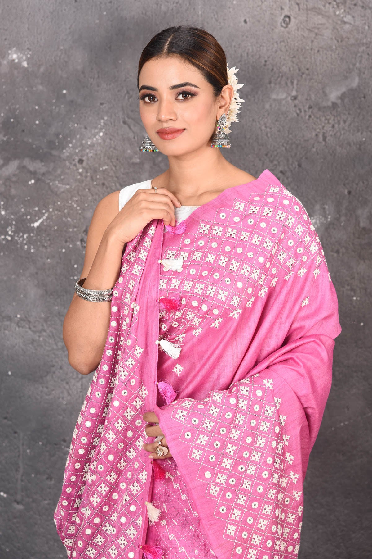 Shop elegant red zari woven pure tussar gicha silk saree in pink color with beautiful mirrorwork online in USA which has crafted by skilled weaver of Banaras with elegance and grace, this saree is definitely the epitome of beauty and a must have in your collection. Buy designer handwoven sarees from Pure Elegance which brings you our latest collection of Bhagalpuri handwoven tussar silk sarees.-Close up.
