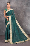Buy exquisite pine green georgette banarasi designer saree with golden heavy Border online in USA which has crafted by skilled weaver of Banaras with elegance and grace, this saree is definitely the epitome of beauty and a must have in your collection. Buy designer handwoven banarasi georgette sari with any blouse from Pure Elegance Indian saree store in USA.-Full view.