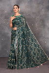Buy exquisite dark green kora silk designer saree with floral jaal print online in USA. Pure kora sarees by Pure Elegance in green color. It has a beautiful floral jaal print all over. This kora brings the charm and simplicity of this saree with border and pallu. Shop this designer silk sari from Pure Elegance Indian fashion store in USA.-Full view with open pallu.
