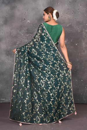 Buy exquisite dark green kora silk designer saree with floral jaal print online in USA. Pure kora sarees by Pure Elegance in green color. It has a beautiful floral jaal print all over. This kora brings the charm and simplicity of this saree with border and pallu. Shop this designer silk sari from Pure Elegance Indian fashion store in USA.-Back view with open pallu.