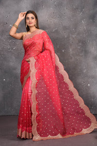 Buy exquisite pink organza saree with golden embroidered online in USA. Pure organza sarees by Pure Elegance in pink color. It has a beautiful gold embroidered border. This organza brings the charm and simplicity of this saree with border and pallu with the delegate embroidery work on border. Shop this designer silk sari from Pure Elegance Indian fashion store in USA.-Full view with open pallu.