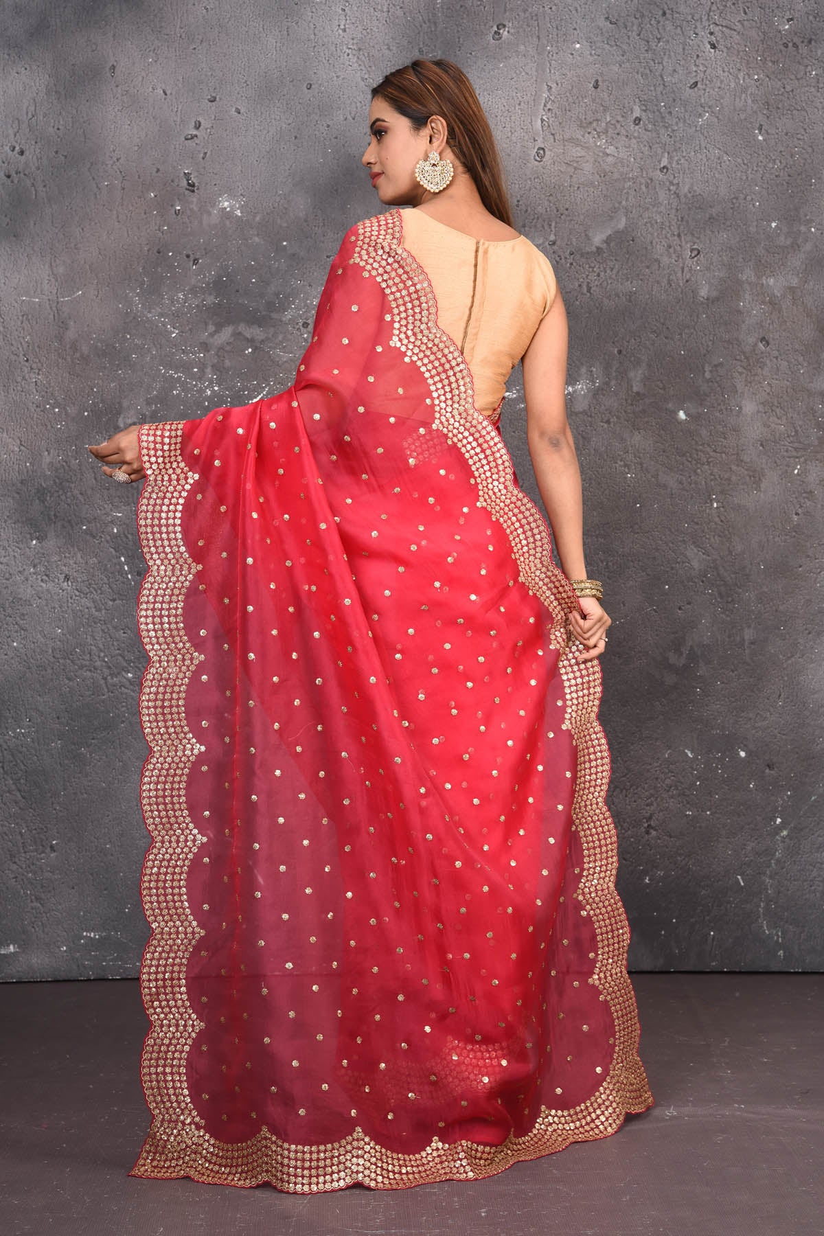 Buy exquisite pink organza saree with golden embroidered online in USA. Pure organza sarees by Pure Elegance in pink color. It has a beautiful gold embroidered border. This organza brings the charm and simplicity of this saree with border and pallu with the delegate embroidery work on border. Shop this designer silk sari from Pure Elegance Indian fashion store in USA.-Back view with open pallu.