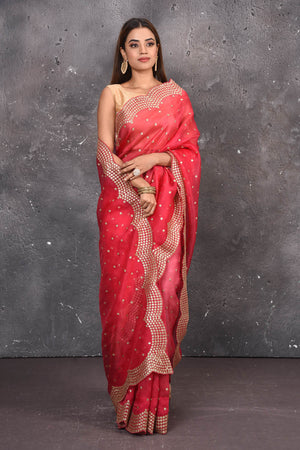 Buy exquisite pink organza saree with golden embroidered online in USA. Pure organza sarees by Pure Elegance in pink color. It has a beautiful gold embroidered border. This organza brings the charm and simplicity of this saree with border and pallu with the delegate embroidery work on border. Shop this designer silk sari from Pure Elegance Indian fashion store in USA..-Full view with wrapped pallu.