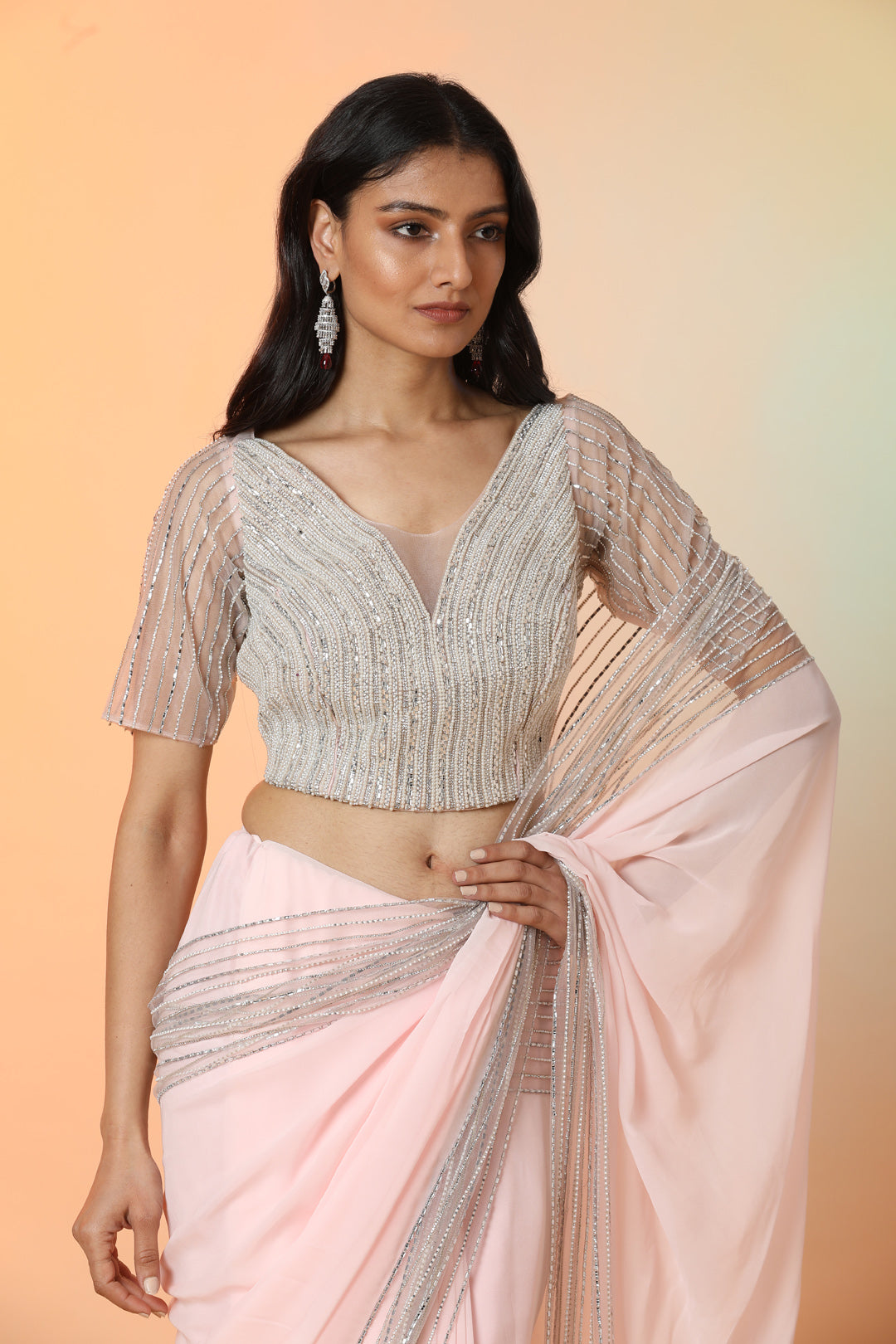 Buy beautiful powder pink georgette designer saree online in USA with blouse. Radiate glamor on special occasions in exquisite designer sarees, embroidered sarees, partywear saris, Bollywood sarees, fancy sarees from from Pure Elegance Indian saree store in USA.-closeup