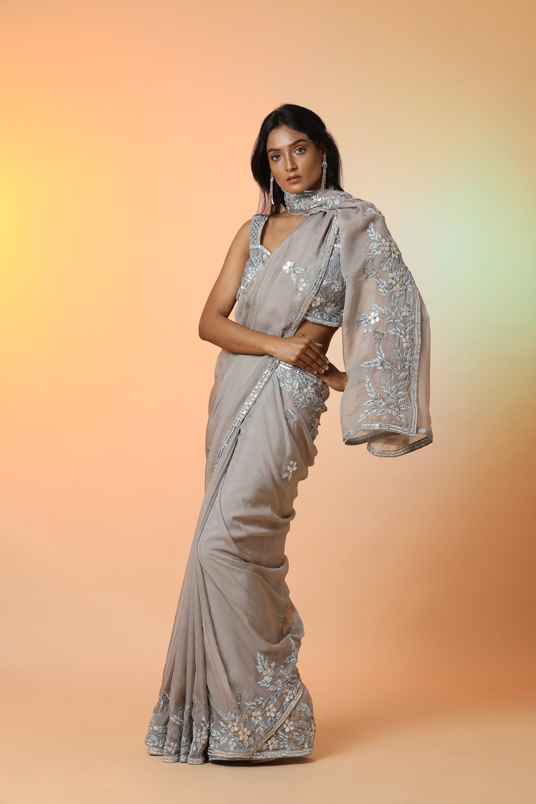 Buy beautiful grey embroidered crepe designer saree online in USA with blouse. Radiate glamor on special occasions in exquisite designer sarees, embroidered sarees, partywear saris, Bollywood sarees, fancy sarees from from Pure Elegance Indian saree store in USA.-side