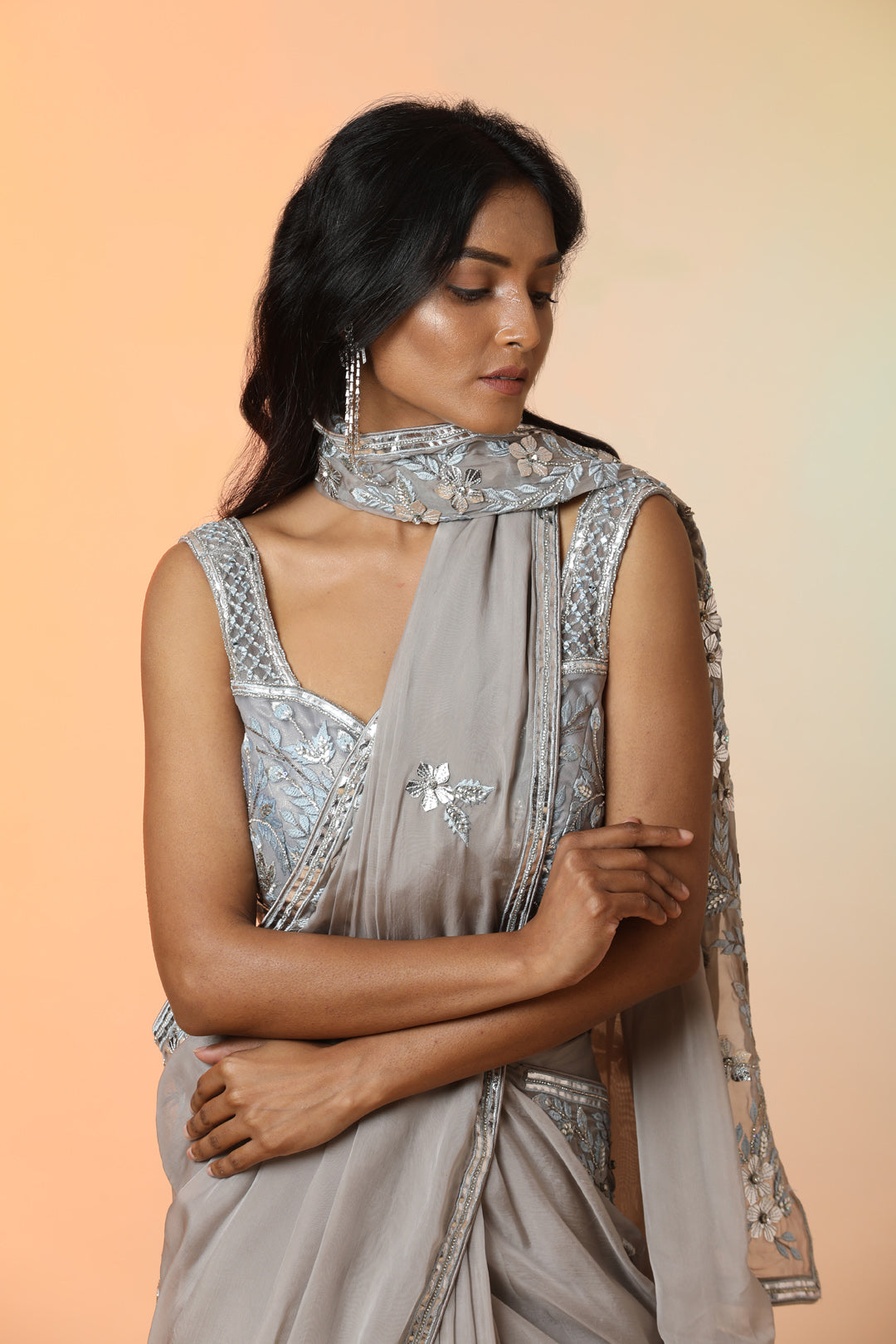 Buy beautiful grey embroidered crepe designer saree online in USA with blouse. Radiate glamor on special occasions in exquisite designer sarees, embroidered sarees, partywear saris, Bollywood sarees, fancy sarees from from Pure Elegance Indian saree store in USA.-pallu