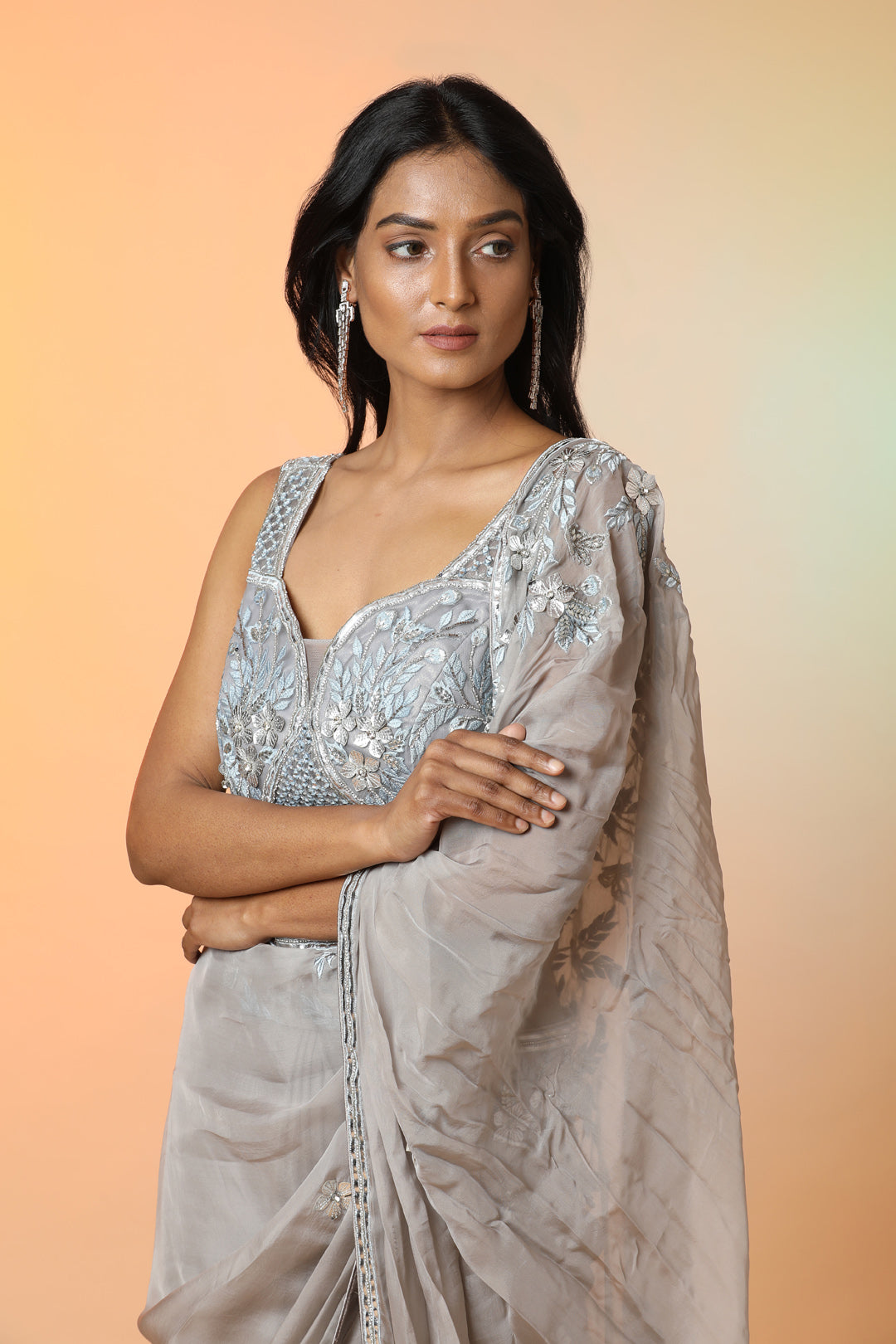 Buy beautiful grey embroidered crepe designer saree online in USA with blouse. Radiate glamor on special occasions in exquisite designer sarees, embroidered sarees, partywear saris, Bollywood sarees, fancy sarees from from Pure Elegance Indian saree store in USA.-closeup