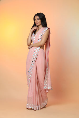 Buy beautiful powder pink georgette sequin saree online in USA with blouse. Radiate glamor on special occasions in exquisite designer sarees, embroidered sarees, partywear saris, Bollywood sarees, fancy sarees from from Pure Elegance Indian saree store in USA.-side