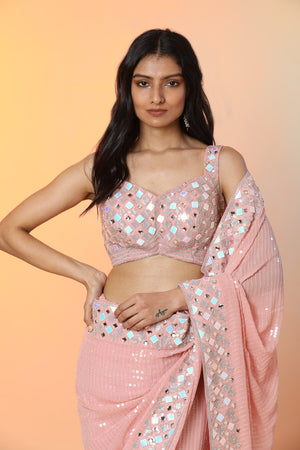 Buy beautiful powder pink georgette sequin saree online in USA with blouse. Radiate glamor on special occasions in exquisite designer sarees, embroidered sarees, partywear saris, Bollywood sarees, fancy sarees from from Pure Elegance Indian saree store in USA.-blouse