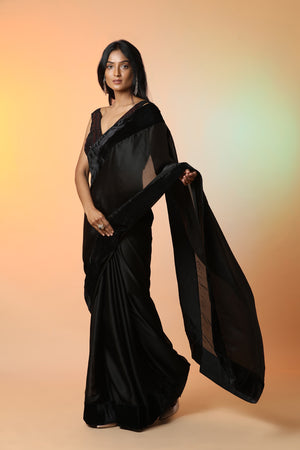Buy beautiful black crepe saree online in USA with velvet border and saree blouse. Radiate glamor on special occasions in exquisite designer sarees, embroidered sarees, partywear saris, Bollywood sarees, fancy sarees from from Pure Elegance Indian saree store in USA.-side
