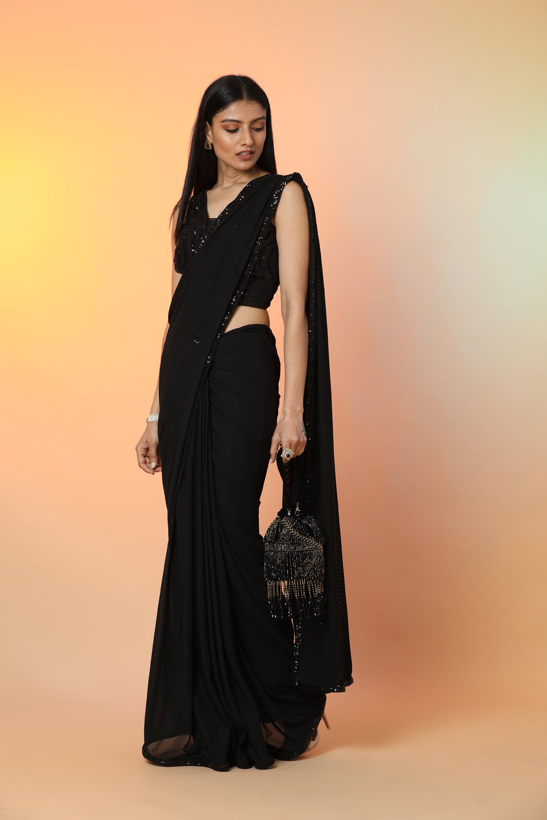 Shop stunning black georgette bead work designer saree online in USA with saree blouse. Radiate glamor on special occasions in exquisite designer sarees, embroidered sarees, partywear saris, Bollywood sarees, fancy sarees from from Pure Elegance Indian saree store in USA.-side