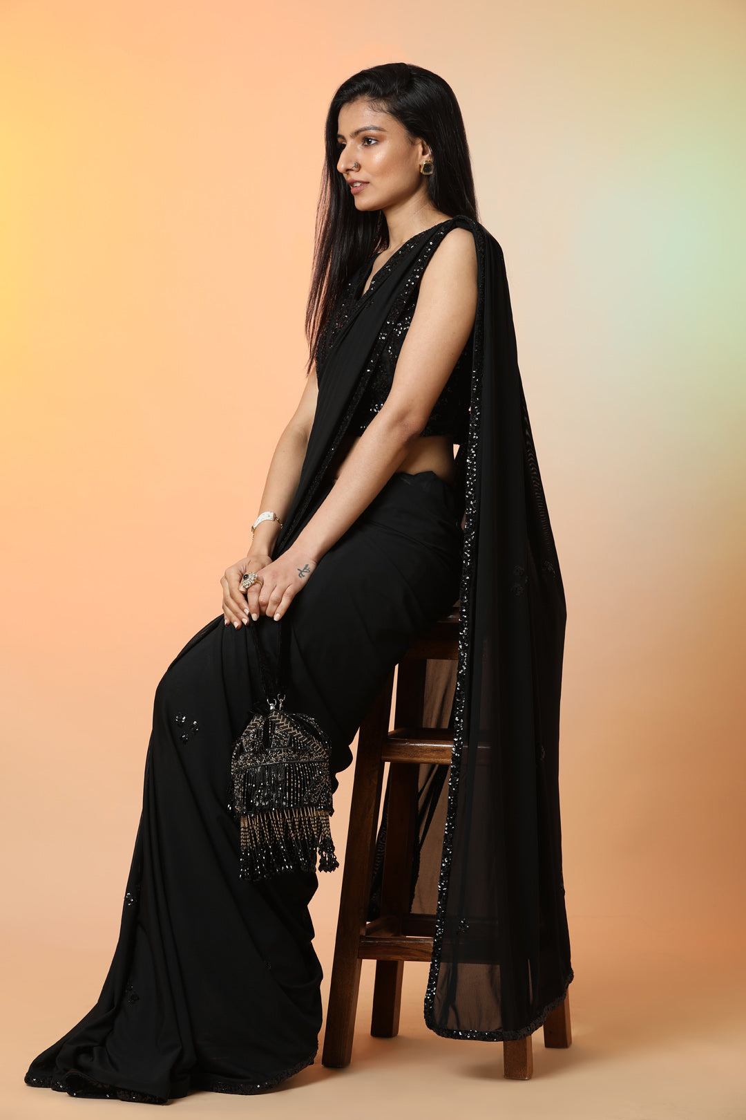 Shop stunning black georgette bead work designer saree online in USA with saree blouse. Radiate glamor on special occasions in exquisite designer sarees, embroidered sarees, partywear saris, Bollywood sarees, fancy sarees from from Pure Elegance Indian saree store in USA.-left