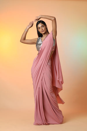 Buy stunning dusty pink ready crepe saree online in USA with metallic saree blouse. Radiate glamor on special occasions in exquisite designer sarees, embroidered sarees, partywear saris, Bollywood sarees, fancy sarees from from Pure Elegance Indian saree store in USA.-front