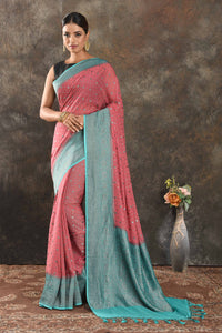 Buy beautiful pink georgette saree online in USA with antique zari blue border. Be vision of elegance on special occasions in exquisite designer sarees, handwoven sarees, georgette sarees, embroidered sarees, Banarasi sarees from Pure Elegance Indian saree store in USA.-full view