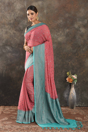 Buy beautiful pink georgette saree online in USA with antique zari blue border. Be vision of elegance on special occasions in exquisite designer sarees, handwoven sarees, georgette sarees, embroidered sarees, Banarasi sarees from Pure Elegance Indian saree store in USA.-pallu