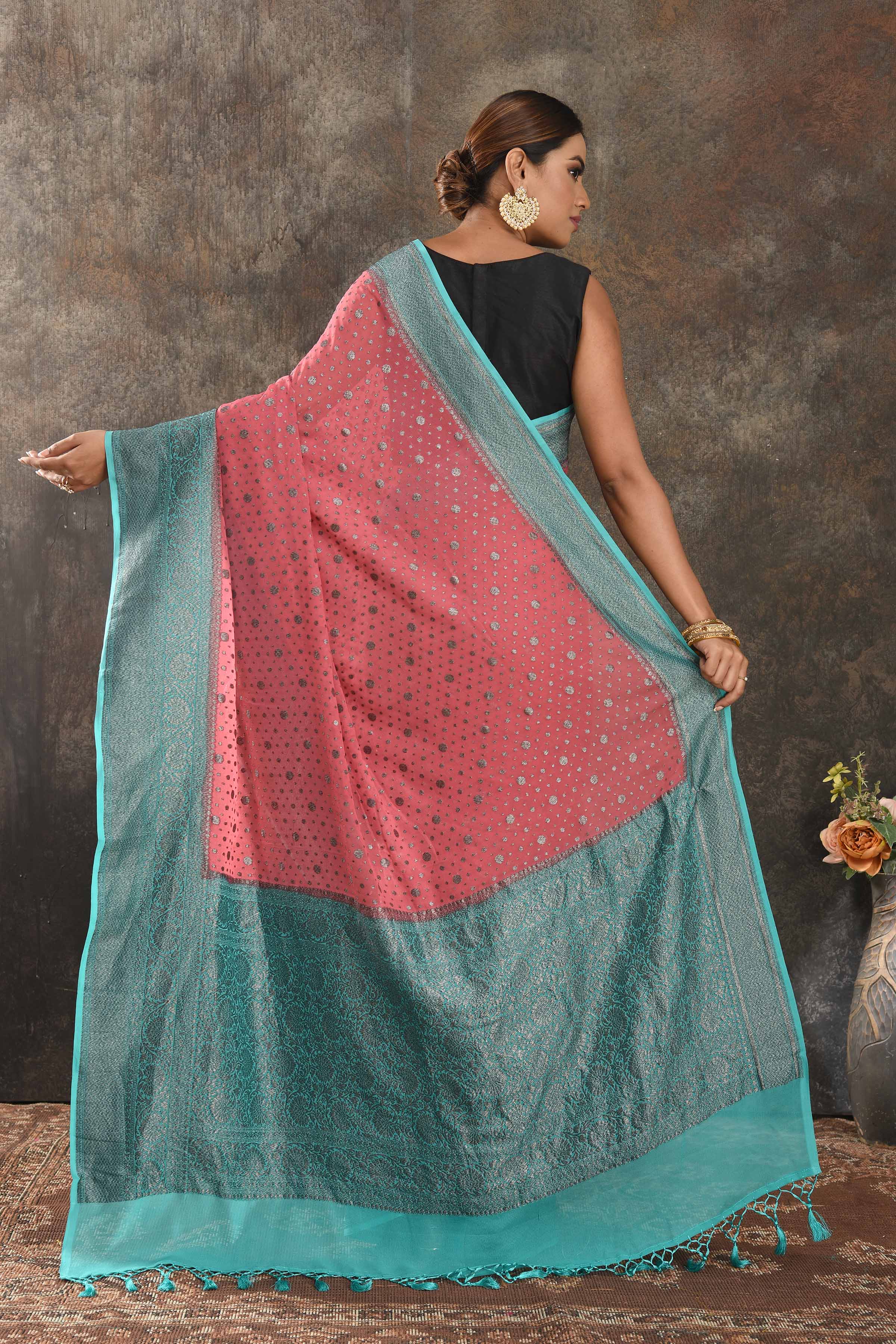 Buy beautiful pink georgette saree online in USA with antique zari blue border. Be vision of elegance on special occasions in exquisite designer sarees, handwoven sarees, georgette sarees, embroidered sarees, Banarasi sarees from Pure Elegance Indian saree store in USA.-back